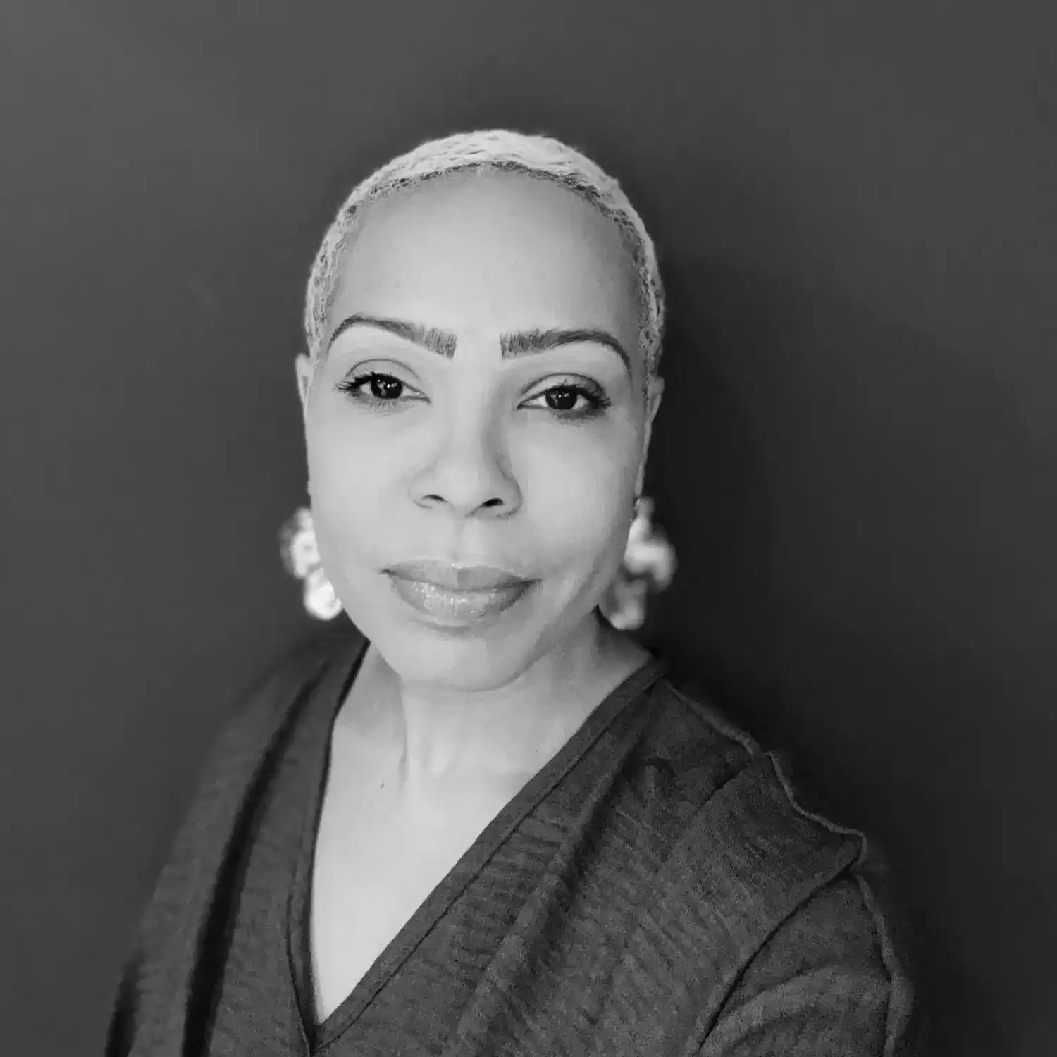 Portrait of April Peele, a professional stylist at Salon SCK, showcasing their expertise and style.