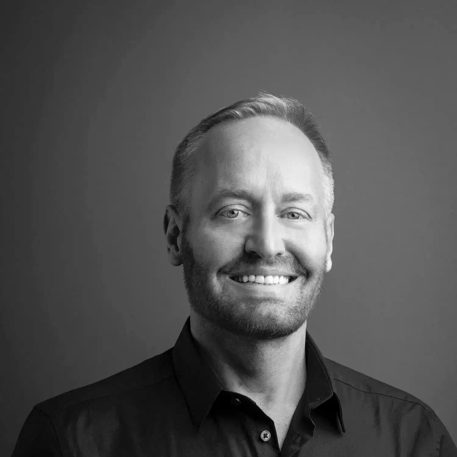 Portrait of Mark Sweet, a professional stylist at Salon SCK, showcasing their expertise and style.