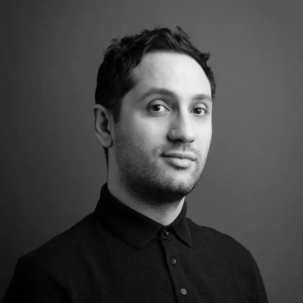 Portrait of Devin Toth, a professional stylist at Salon SCK, showcasing their expertise and style.