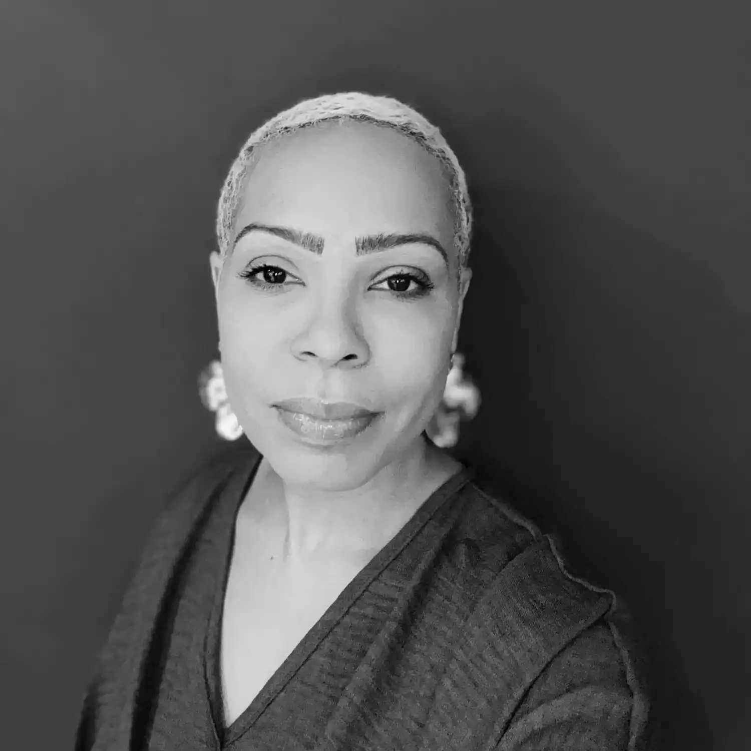 Portrait of April Peele, a professional stylist at Salon SCK, showcasing their expertise and style.