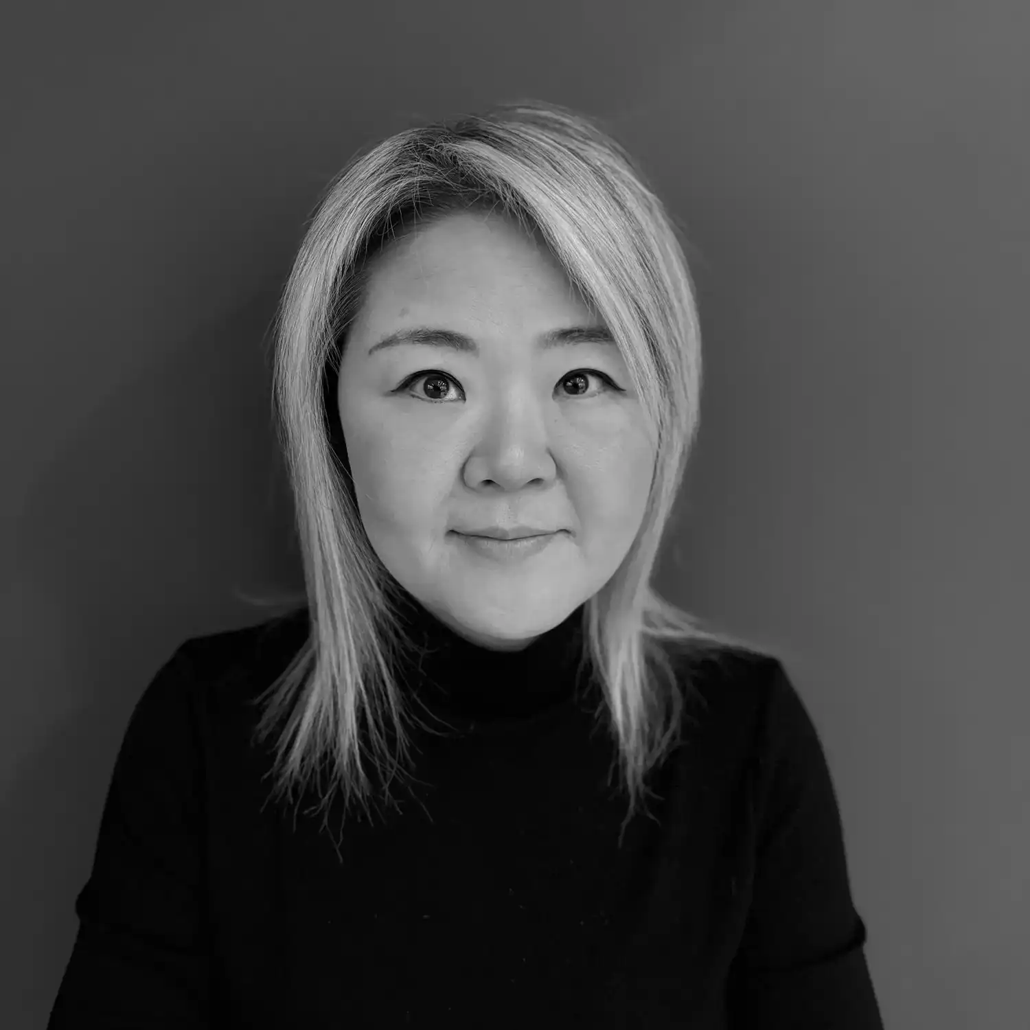 Portrait of Heather Lee, a professional stylist at Salon SCK, showcasing their expertise and style.