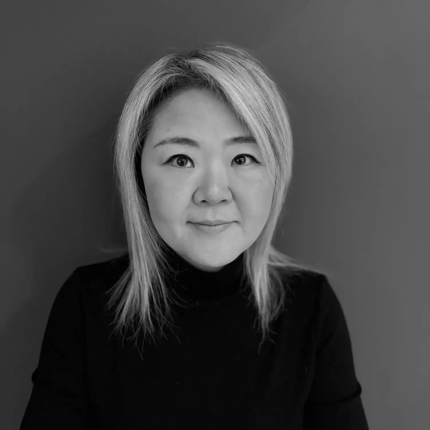 Portrait of Heather Lee, a professional stylist at Salon SCK, showcasing their expertise and style.