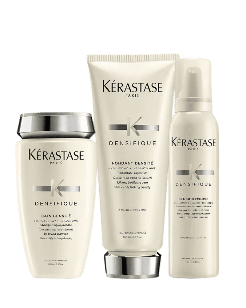 Kérastase Densifique hair products: shampoo, conditioner, mousse in sleek packaging.