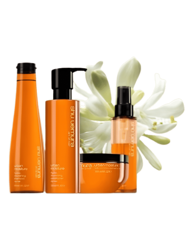 Orange haircare products with a white flower background.